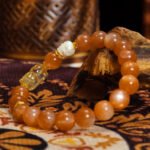 Buddha-Inspired Orange Moonstone & Golden Rutilated Quartz Bracelet – Natural Crystals for Confidence & Clarity