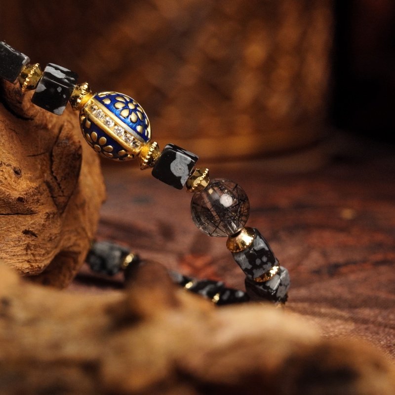 Groxiara Snowflake Obsidian & Black Rutilated Quartz Bracelet – Blue Enamel Gold Accent