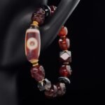 Red Agate Skull & Dzi Bead Bracelet – Protection, Power & Spiritual Awakening