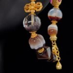 Dzi Bead & Skull Guardian Bracelet with Ruby Gold Accents – Protection, Wisdom & Sacred Power