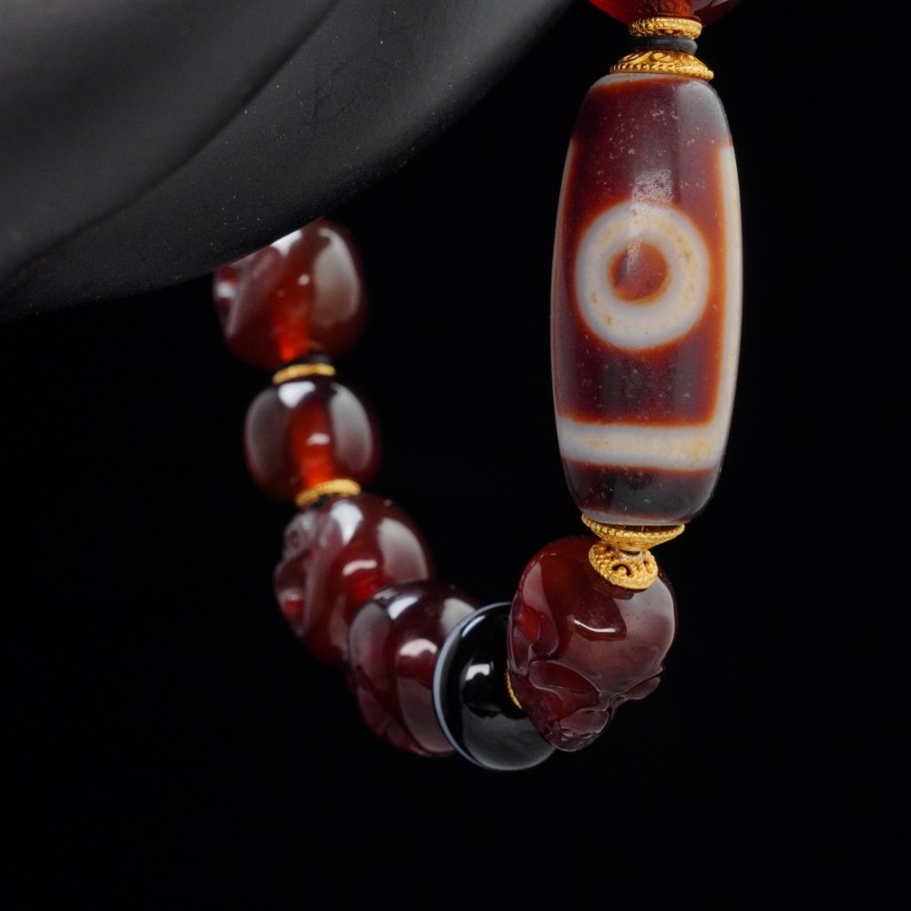 Red Agate Skull & Dzi Bead Bracelet – Protection, Power & Spiritual Awakening