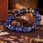 Blue Agate Skull & Black-White Dzi Bead Bracelet – Protection, Courage & Spiritual Awareness