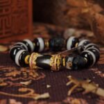 One-Line Dzi & Black Skull Bracelet – Warrior Focus & Mystic Defense